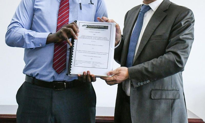 KeNHA Director General Eng. Peter Mundinia with representative from China Communication Construction Company (CCCC)