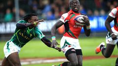 Legendary Kenya 7s rugby Utility Back Collins Injera swiftly evades a challenge from South African scrum half Branco du Preez in a past rugby tournament.
