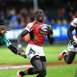 Legendary Kenya 7s rugby Utility Back Collins Injera swiftly evades a challenge from South African scrum half Branco du Preez in a past rugby tournament.