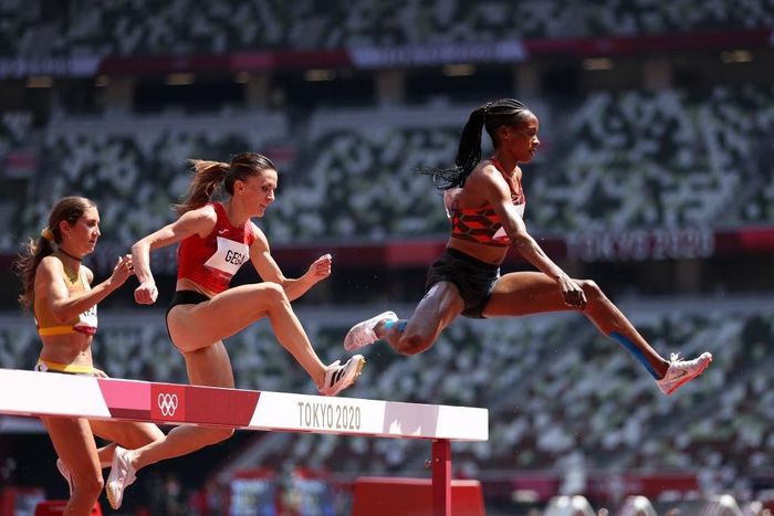 TOKYO, JAPAN - AUGUST 01: Beatrice Chepkoech of Team Kenya runs ahead of Luiza Gega of Team Albania in round one of the Women's 3000m Steeplechase heats on day nine of the Tokyo 2020 Olympic Games at Olympic Stadium on August 01, 2021 in Tokyo, Japan. ...