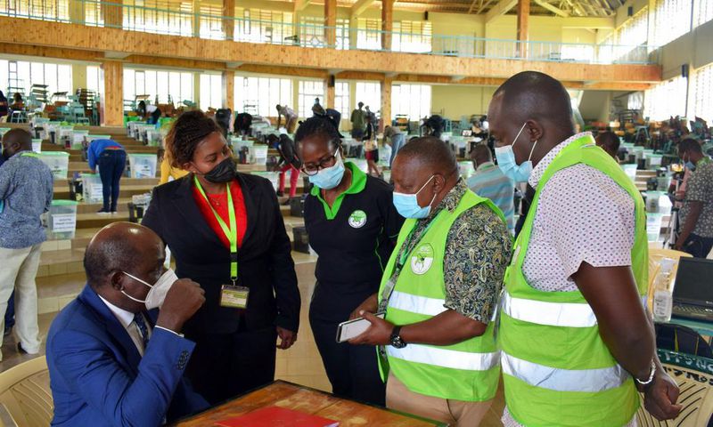IEBC Chairperson Wafula Chebukati with elections officials at Mang'u Tallying Centre