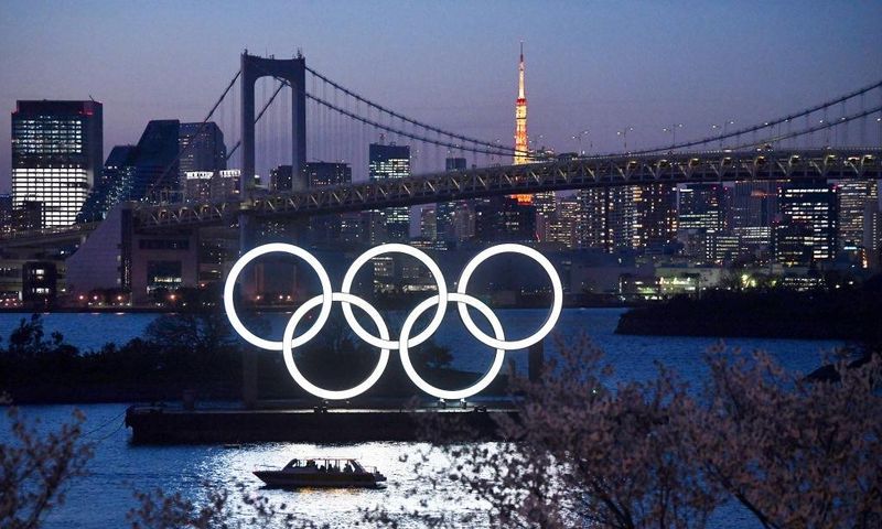 TOKYO, JAPAN - MARCH 25: A boat sails past the Tokyo 2020 Olympic Rings on March 25, 2020 in Tokyo, Japan.  (Photo by Carl Court/Getty Images)