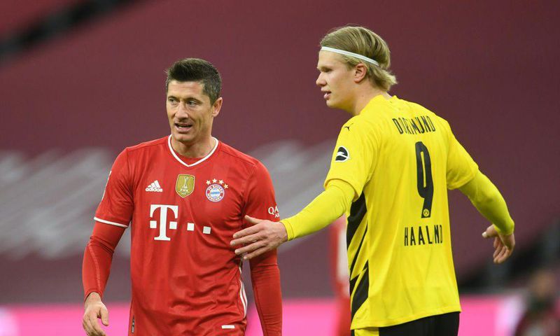 Bayern Munich striker Robert Lewandowski (L)and Dortmund forward Erling Haaland (R) are set to go head-to-head Saturday