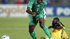 Enyimba coach Finidi George (L) playing for Nigeria against Ghana during the 2002 Africa Cup of Nations in Mali.