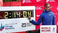 Brigid Kosgei poses next to her new world record.