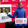 Brigid Kosgei poses next to her new world record.