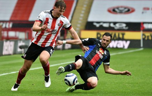 Sheffield United midfielder John Fleck has tested positive for coronavirus and is to self-isolate at Scotland's pre-Euro 2020 training camp in Spain the Scottish Football Association announced