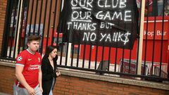 Supporters protest against Liverpool's US owner John W. Henry and the Fenway Sports Group