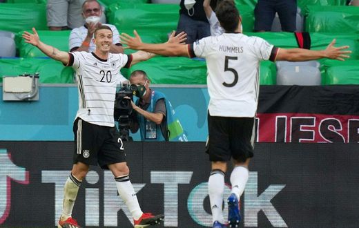 Robin Gosens (L) celebrates scoring Germany's fourth goal in Munich on Saturday at Euro 2020