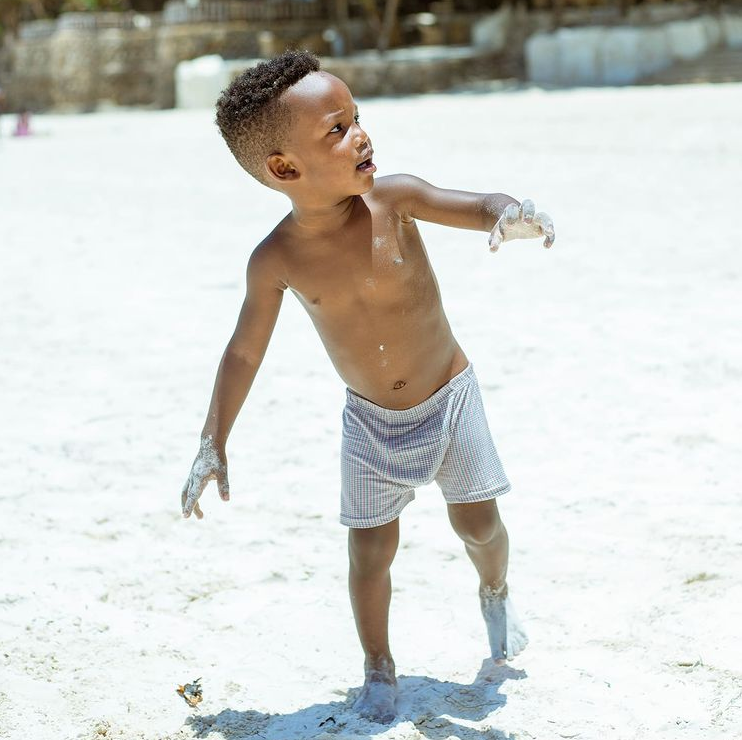 Kenyan athlete Ferdinand Omanyala vacations with his wife and son at the Coast