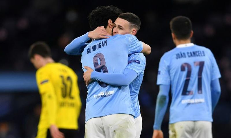 Manchester City midfielder Phil Foden (second right) celebrates his goal against Borussia Dortmund