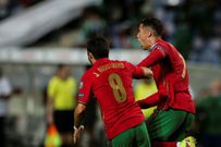 Cristiano Ronaldo (R) scored a dramatic late double to take his tally to 111 international goals