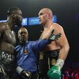 American boxer Deontay Wilder in the ring with British boxer Tyson Fury