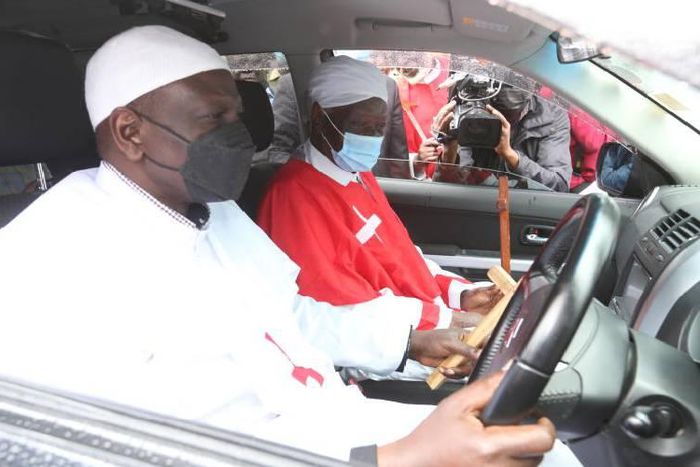 Deputy President William Ruto hands over a new car that he donated to the African Church of the holy spirit high priest Shem Shamalla at Malava in Kakamega on September 18, 2021