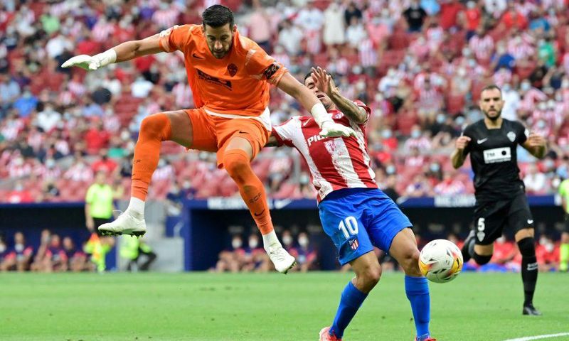 Artful dodger: Angel Correa dodged a challenge from goalie Kiko Casillas and ran on to score