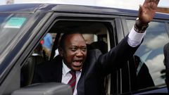 President Uhuru Kenyatta waving from his car