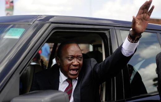 President Uhuru Kenyatta waving from his car