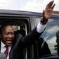 President Uhuru Kenyatta waving from his car