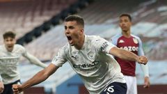 Manchester City midfielder Rodri celebrates scoring at Aston Villa