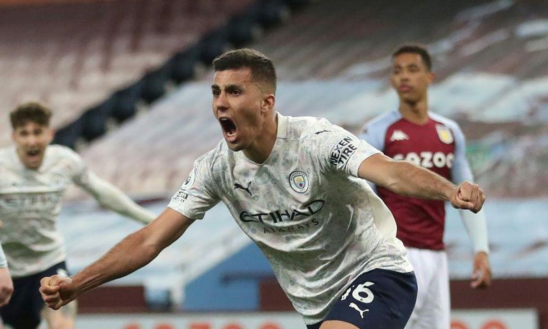 Manchester City midfielder Rodri celebrates scoring at Aston Villa