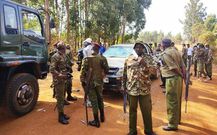 Police officers keeping guard during Kabuchai by-election