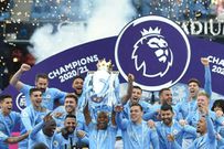 Manchester City midfielder Fernandinho lifts the Premier League trophy