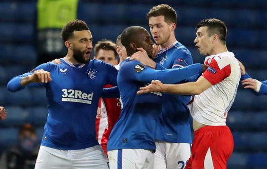 Ondrej Kudela (R) was given a 10-match ban for racially abusing Rangers midfielder Glen Kamara (C) earlier this year
