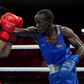 Kenya's Nicholas Okongo Okoth and Mongolia's Tsendbaatar Erdenebat fight during their men's feather (52-57kg) preliminaries boxing match during the Tokyo 2020 Olympic Games at the Kokugikan Arena in Tokyo on July 24, 2021. (Photo by Frank Franklin II /...