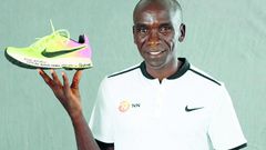 Eliud Kipchoge with his Rio Olympic shoe which was first displayed at the 2019 IAAF Heritage World Athletics Championships Exhibition in Doha, Qatar.
