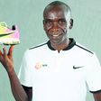 Eliud Kipchoge with his Rio Olympic shoe which was first displayed at the 2019 IAAF Heritage World Athletics Championships Exhibition in Doha, Qatar.