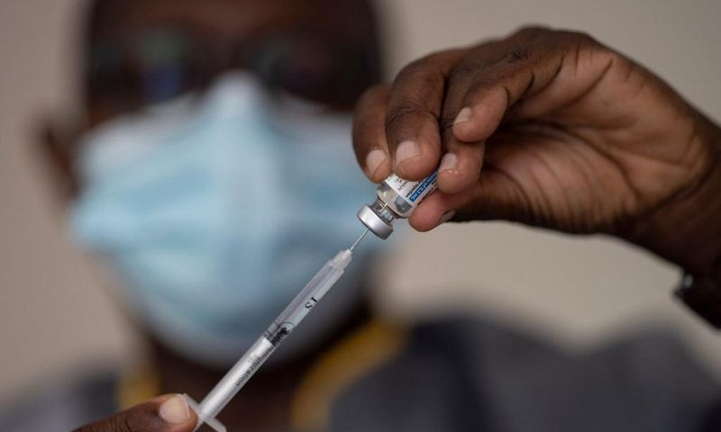 In this Wednesday, July 28, 2021 file photo, a health worker administers a dose of Janssen COVID-19 vaccine by Johnson & Johnson in the Medina neighborhood in Dakar, Senegal.