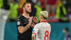 Arnautovic (L) spoke to Alioski (R) after the game