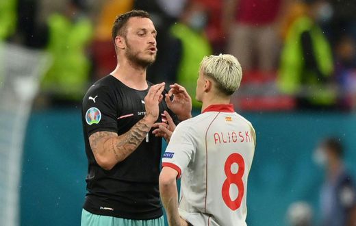 Arnautovic (L) spoke to Alioski (R) after the game