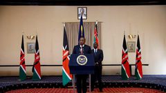 Kenya's President Uhuru Kenyatta and his Deputy William Ruto deliver a statement to members of the media at the State House in Nairobi.