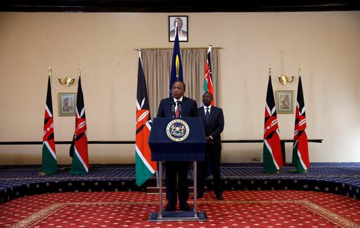 Kenya's President Uhuru Kenyatta and his Deputy William Ruto deliver a statement to members of the media at the State House in Nairobi.