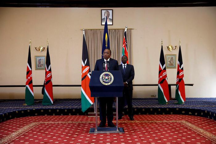 Kenya's President Uhuru Kenyatta and his Deputy William Ruto deliver a statement to members of the media at the State House in Nairobi.
