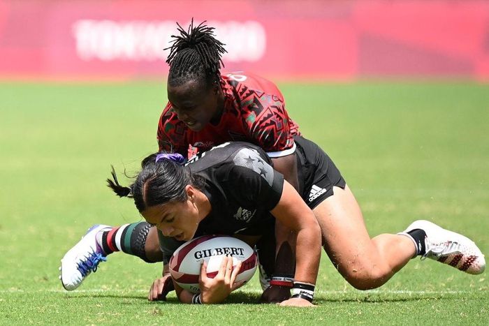 New Zealand's Stacey Fluhler is tackled by Kenya's Janet Okello during the women's pool A rugby sevens match between New Zealand and Kenya during the Tokyo 2020 Olympic Games at the Tokyo Stadium in Tokyo on July 29, 2021. (Photo by GREG BAKER / AFP) (...