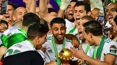Captain Riyad Mahrez (C) holds the Africa Cup of Nations trophy after Algeria defeated Senegal in the 2019 final in Cairo