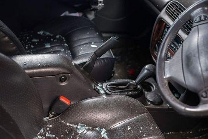 Shattered glass inside of a car after an ambush