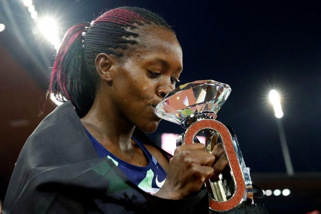 Kenya's Faith Kipyegon celebrates after winning the women's 1500m event of the IAAF Diamond League athletics meeting "Weltklasse" in Zurich on September 9, 2021. (Photo by STEFAN WERMUTH / AFP) (Photo by STEFAN WERMUTH/AFP via Getty Images)