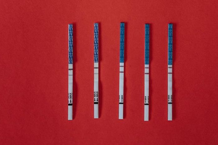 Close-up shot of positive pregnancy test strips [Image: Olia Danilevich]