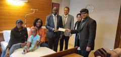 Ethan Macharia, his mother Veronica Njeri ( in pink) with officials from the Kenyan Embassy in India and his doctors at the Forties hospital on Friday, February 29, 2020 after President Uhuru Kenyatta intervened