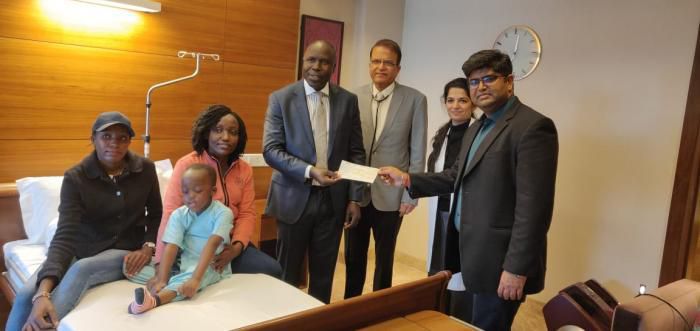 Ethan Macharia, his mother Veronica Njeri ( in pink) with officials from the Kenyan Embassy in India and his doctors at the Forties hospital on Friday, February 29, 2020 after President Uhuru Kenyatta intervened