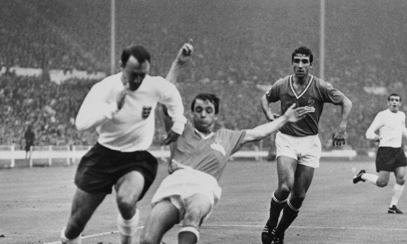 Former England striker Jimmy Greaves, seen here playing against France in the 1966 World Cup, has died aged 81