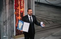 Earlier into his term, Ethiopian PM Abiy Ahmed proudly displays his nobel prize award.