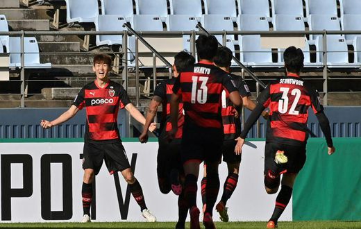 Pohang Steelers' Lee Seung-mo celebrates scoring against
Nagoya Grampus