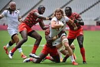 USA's Joe Schroeder (2nd R) tries to break through Kenya's defence in the men's pool C rugby sevens match between the USA and Kenya during the Tokyo 2020 Olympic Games at the Tokyo Stadium in Tokyo on July 26, 2021. (Photo by Ben STANSALL / AFP) (Photo by BEN STANSALL/AFP via Getty Images)