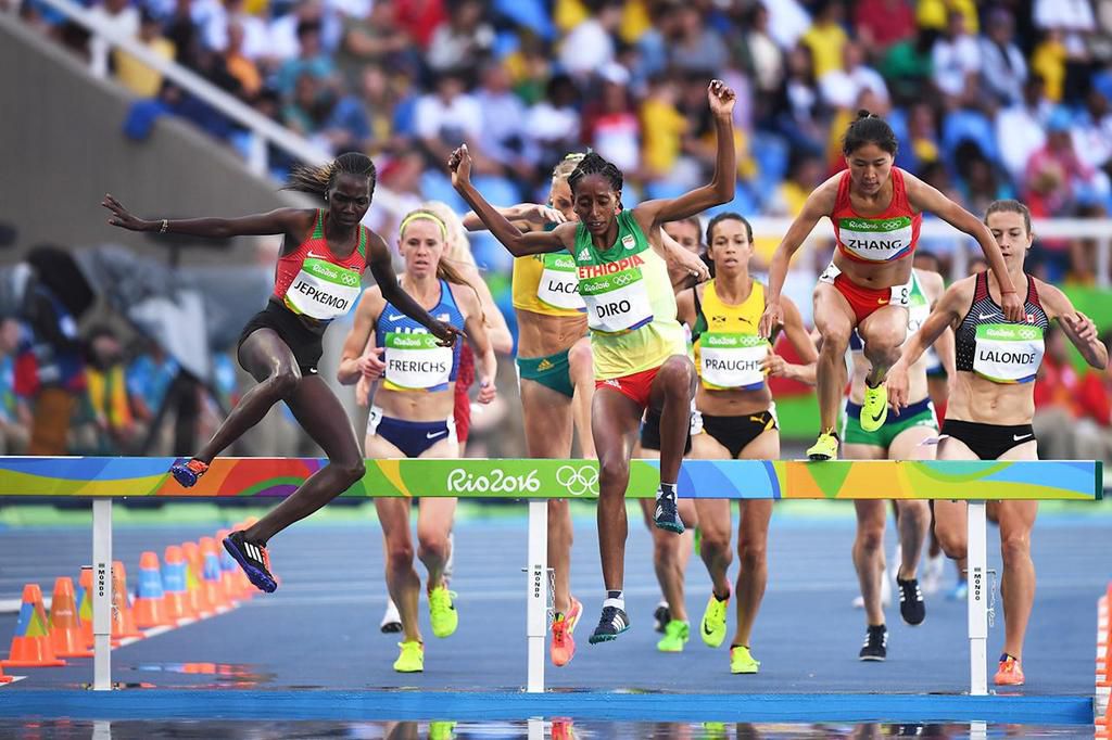 From (R-L) Xinyan Zhang of China, Etenesh Diro of Ethiopia and Hyvin Kiyeng Jepkemoi of Kenya compete in the Women’s 3000m Steeplechase Round 1 on Day 8 of the Rio 2016 Olympic Games at the Olympic Stadium on August 13, 2016 in Rio de Janeiro, Brazil. ...