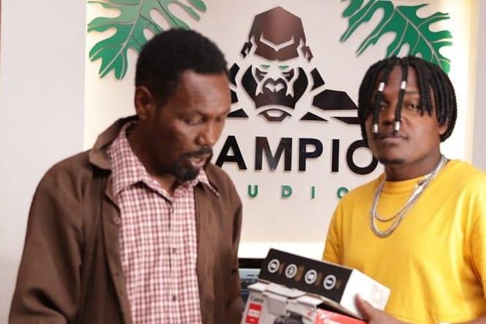 Singer B-Classic gifts Omosh, a camera, Tripod and Microphone