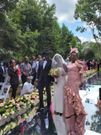 Deputy President William Ruto and wife Rachel walk June Ruto on the aisle at her wedding